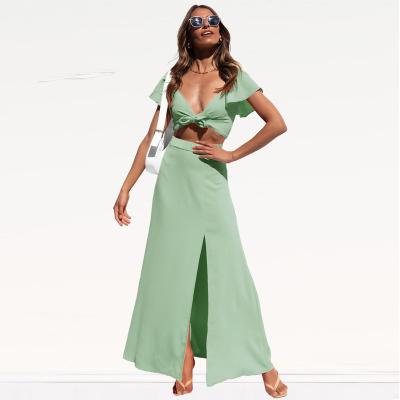 China Solid Color Anti-Static Women Two Piece Dress Sets Vacation V-Neck Lace Up Summer Outfits 2 Piece Sets For Woman Top And Slit Skirts for sale