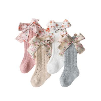 China Breathable Spanish Western Heavy Industry Children's Ins Floral Bow In Stocking Baby Transfer Ring Baby Mesh Socks for sale