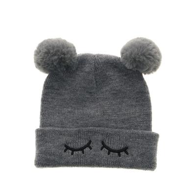 China Hot Selling Cute Kids COMMON Beanie Hat Faux Fur Double Pom Pom Winter Hats for sale