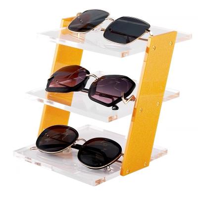 China OEM/ODM Sunglasses Game Machine Storage Acrylic Display Stand Removable Custom Clear Acrylic Display Stand for sale