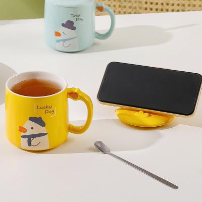 China Duck Ceramic Coffee Cup Creative Phone Holder Lid Kawaii Household Milk Water Cup Viable Cute Coffee Cup With Lid for sale