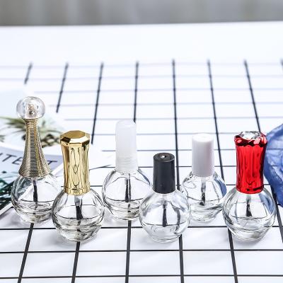 China Cosmetic 3ml 5ml 10ml nail polish glass bottle with removable brush and colorful lids for sale