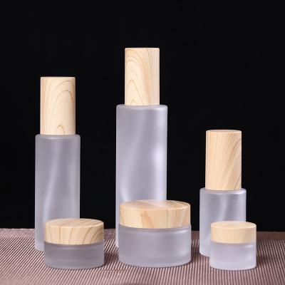 China Cosmetic Factory high quality 100ml Frosted cosmetic skin care glass empty bottle set with dropper and sprayer for sale