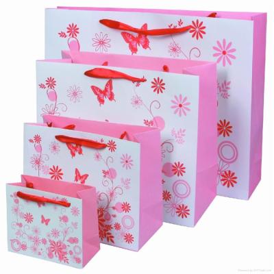 China Wholesale Recyclable Luxury Pink Cardboard Fashion Gift Retail Shopping Paper Bags With Ribbon Handle for sale