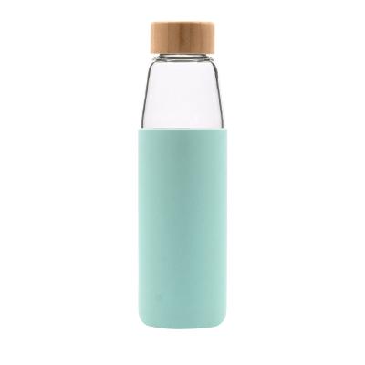 China WeVi OEM Logo 550ml Sustainable Borosilicate Glass Reusable Water Bottle With Lid Silicone Bamboo Cover Bottles Bpa Free for sale