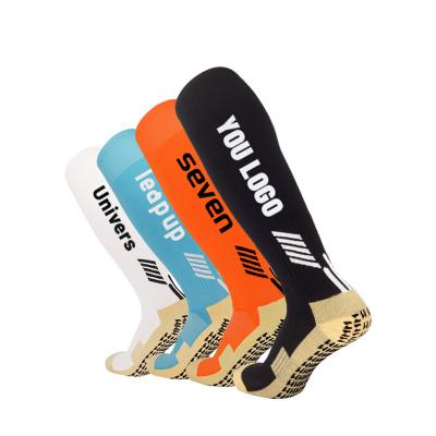 China Sporty Adhesive non-slip football socks foreign trade custom LOGO embroidery men's tall sports socks cross-border long socks for sale