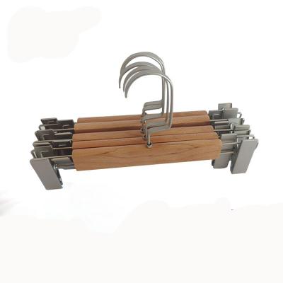 China China Supplier Lotus Solid Wood Pants Hangers Nickel Bead Modern Wholesale Flat Hook Coat Wood Hanger With Clips for sale