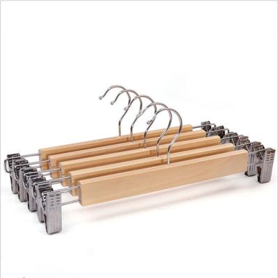 China Customized wholesale color modern log pants non-slip round hook wooden pants hanger hangers with printing clips for sale