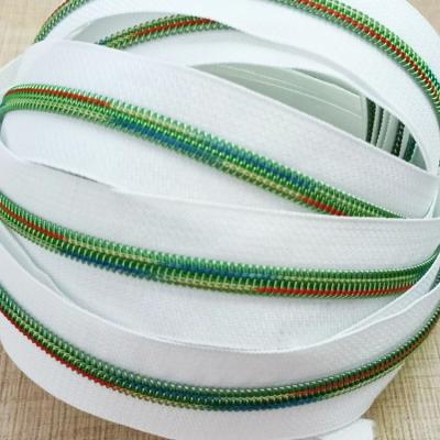 China Durable 5# Nylon Zipper Rainbow Colored Tape With Metallic Teeth For Zipper Bags for sale