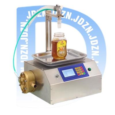 China 16 KG Beverage Filling Machine with Smart Automatic Honey Jar Filling Advancement for sale