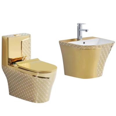 China Modern Luxury Electroplate Toilet Bowl Gold Bathroom Sanitary Ware Gold Ceramic Wall Hung Sink And Toilet Set for sale