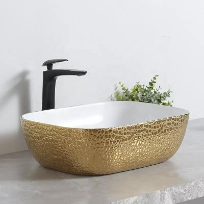 China Modern Designs Bathroom Ceramic Oval Sink Countertops Luxury Gold Sink for sale