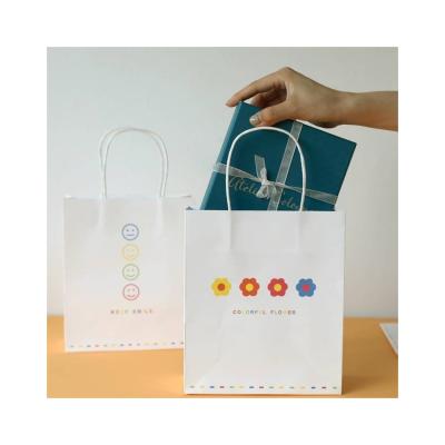 China Recyclable Luxury Custom Printed Full Logo Printed Cardboard Paper Bag Gifts Bag for sale