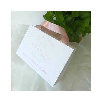 China Recyclable Luxury Custom Gift Paper Shopping Bags Logo Pink Stamping Printed White for sale