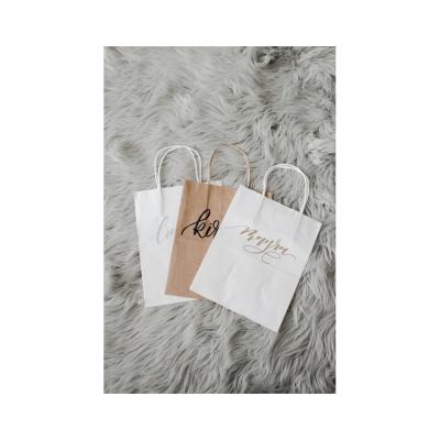 China Recyclable Custom Logo Paper Kraft Shopping Packaging Bag With Handle for sale