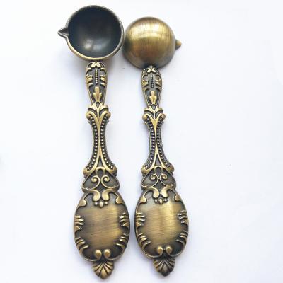 China Eco-friendly Quality Retro Wax Beads Cast Peacock Handle Spoons Sealing Wax Spoon for sale