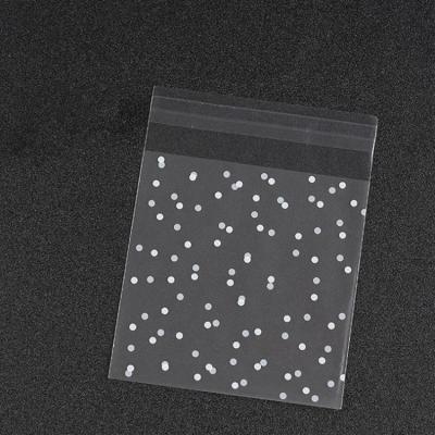 China 100pcs/set White Transparent Frosted Candy Cookie Candy Packaging Bag Dots Plastic Christmas Gift Bag OPP for sale