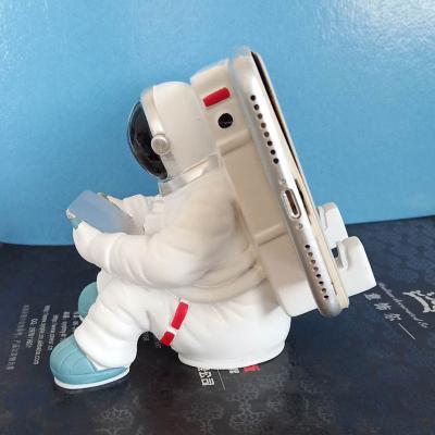 China Cute Adjustable Fashion Cartoons Space Astronaut Toys Phone Holder Flexible Universal Phone Holder Stand for sale