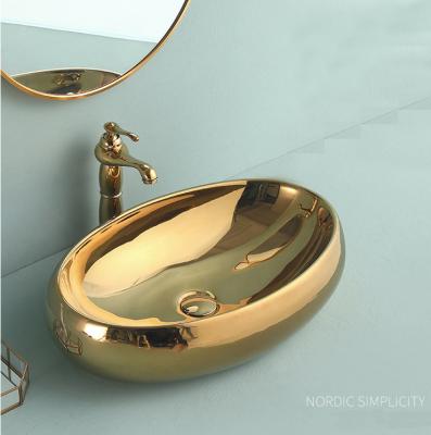 China Contemporary Counter Top Wash Basin Outlet Ceramic European Silver Oval Wash Basin Gold Plated For Use In Bathroom Toilet Sink for sale