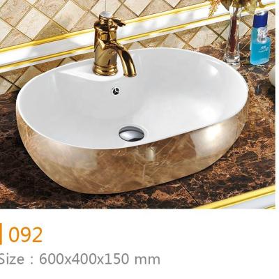 China Modern Desgin Bathroom Low Price Above Countertop Oval Basin Ceramic Hand Wash Basin Sink for sale