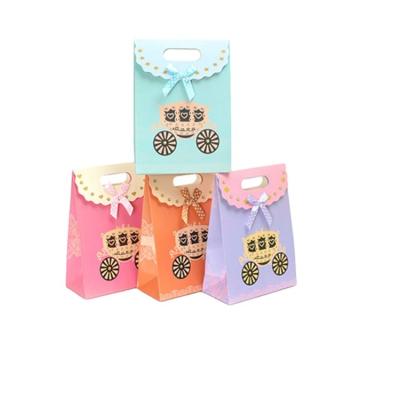 China Die Cut Cartoon Design Recyclable Handmade Handles Cute Little Christmas Paper Gift Bag With Dot Ribbon Bows for sale