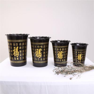 China Competitive Price China Transitional Black Painted Plastic Garden Flower Pots for sale