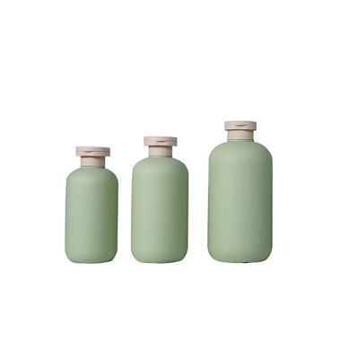 China Clear/Brown 200/250/300/400/500ml High Quality Cosmetic Shampoo Green Plastic Empty Bottles With Flip Top Cap for sale