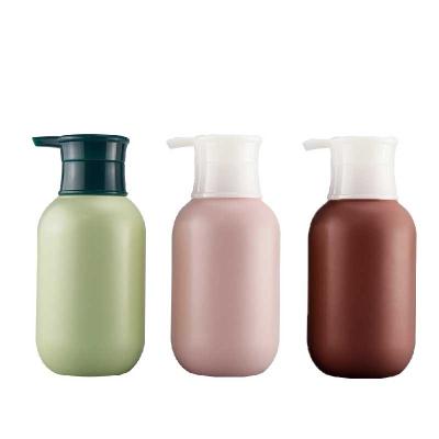 China Cosmetic Organic Luxury 400ml Pink Green Round Shoulders Soft Suede Empty Plastic Lotion Bottles For Shampoo Body Wash for sale