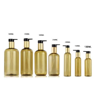 China 130ML Cosmetic 150ml 200ml 250ml 300ml 350ml 500ml 8oz PET Gold Shampoo Empty Plastic Bottle With Matte Gold Lotion Pump for sale