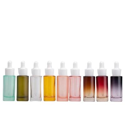 China Shoulder 30 ml 50ml flat bottom thick round dropper cosmetic serum gradient color glass bottle for essential oil for sale