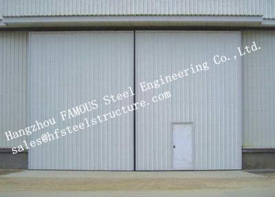 China Sectional Horizontal Industrial Sliding Doors With Access Pedestrian Door For Workshop for sale