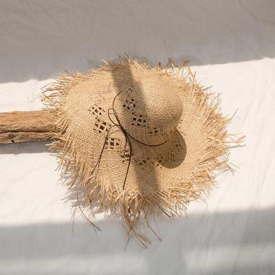 China New Summer Character Women Raffia Beach Wide Brim Raffia Straw Hat PaHollow Sun Protection Beach Sombrero Straw Hat for sale