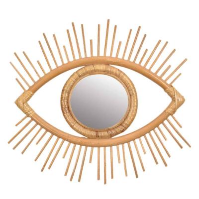 China Hot Selling Fashion Living Room Wall Mounted Hanging Mirror For Home Decor Modern Eye Shape Rattan Mirror for sale