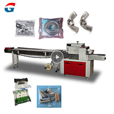 China CLOTHING jars Hardware Accessories Wrap Packaging Machine Horizontal Flow Spare Parts Packaging Machine for sale