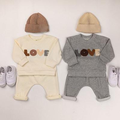 China Casual Baby Boy Girl Clothes Suit Letter Print Waffle Long Sleeve Pullover+ Pants Spring Autumn 0-5Yrs Kids Clothing Set for sale