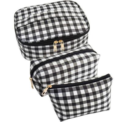 China Durable Custom Zipper Make Up Cosmetic Pouch Makeup Bag Fashion Trends Girls Bags Travel Waterproof Brushes Checkered Makeup Bag for sale