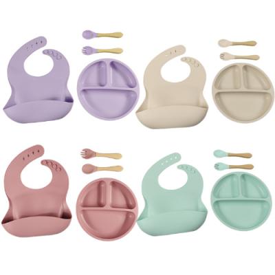 China Gift Box Baby Christmas 4 Pcs Dinnerware Set Silicone Bib Wrapping Cutlery Set With Suction Cup, Spoon, Fork Waterproof Wooden Handle for sale