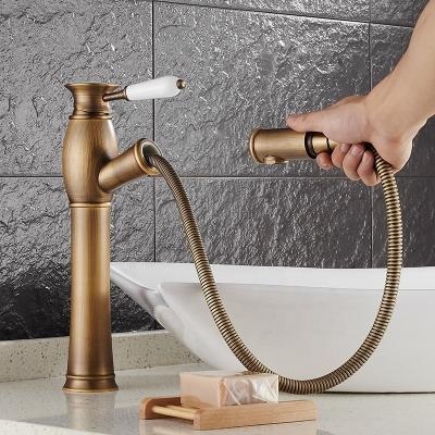 China Metered Faucets Classic Single Handle Pull Out Basin Sink Bathroom Antique Brass Copper Faucet for sale