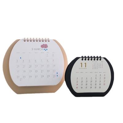 China New Design Table Desk Mini Calendar Over Pocket Flip Book Calendar 2022 2023 Creative Oval Calendar Customized Oval Calendar for sale