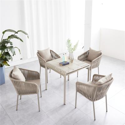 China Finished with soft aluminum frames and modern olefin cushions desgin dining set with rope weave chair dining table outdoor furniture for garden living for sale