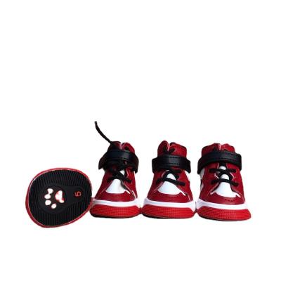 China Durable 4 Pcs / Set Fashion Luxury Winter Brand Leather Waterproof Dog Sneakers Shoes for sale