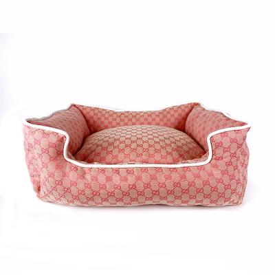 China Luxury Designer Stocked Winter Warm Pink and Brown Dog Sofa Bed for sale