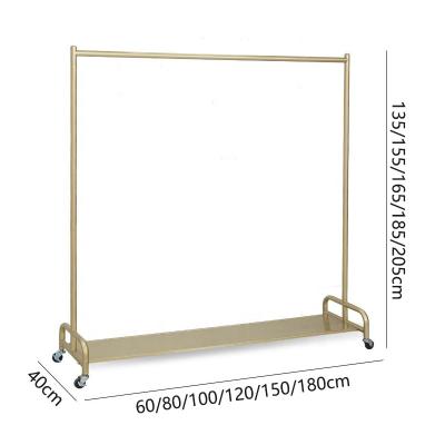 China Floor Type Clothing Store Shelf Hanger (Other) Clothing Store Display Rack Gold Adjustable Women's Clothing Rack Movable Rack With Wheels for sale