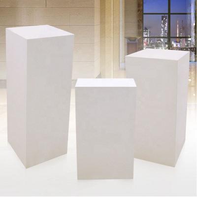 China Artificial Stone Marble Pedestal in Decoration Modern White Marble Display Hotel Lobby Table Side Carving Base for sale