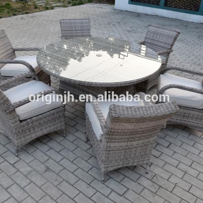 China Contemporary Luxury Modern Aluminum Frame Round Patio Table And Dining Armchairs Rattan Furniture Outdoor Sets for sale