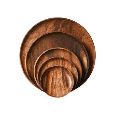 China Half manual wholesale nordic hot sale cheap rubber solid wood food fruit serving charger plate round acacia wooden plate for sale