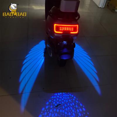 China Cool Angel Wing Blue White Red Color Motorcycle Projector Lights for sale