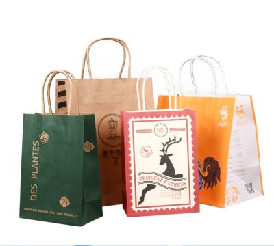 China Recycled Materials Recyclable Kraft Paper Bag With Twisted Handle Reusable Shopping Paper Bags Logo Printed for sale