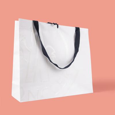 China Recycled Materials Printing Custom Paper Shopping Bags With Your Own Logo for sale