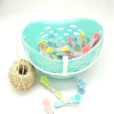 China Handles Around Plastic Laundry Hamper with 24pcs TPR Plastic Clothespins, Plastic Clothespin Hanging Pin Clothespin Basket for sale